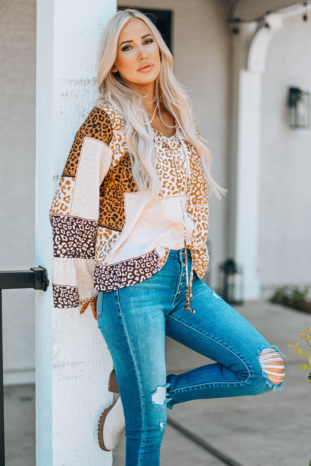 Brown Colorblock Leopard Ribbon Tie Blouse featuring a V-neck and long sleeves, designed for a relaxed fit.