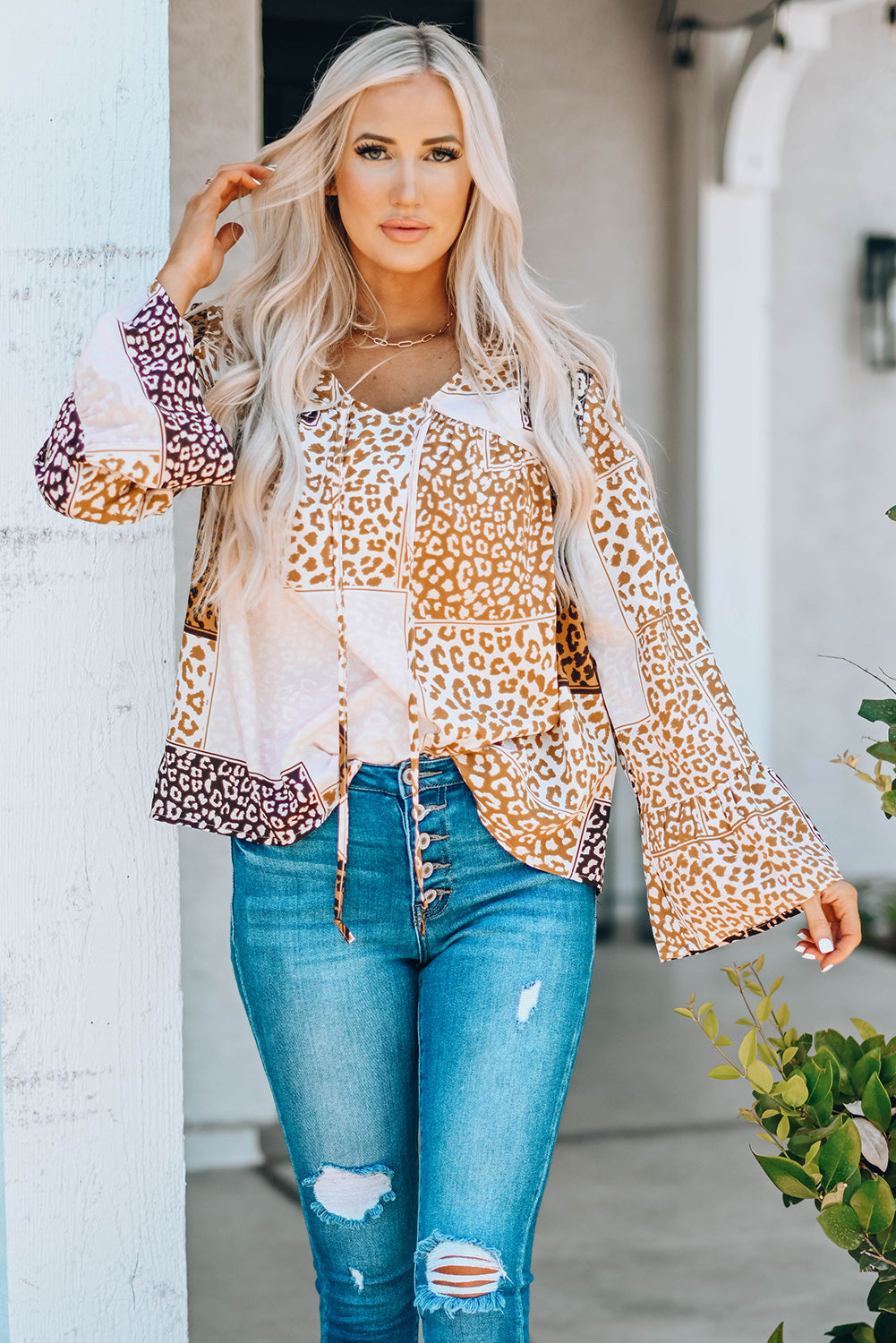 Brown Colorblock Leopard Ribbon Tie Blouse featuring a V-neck and long sleeves, designed for a relaxed fit.