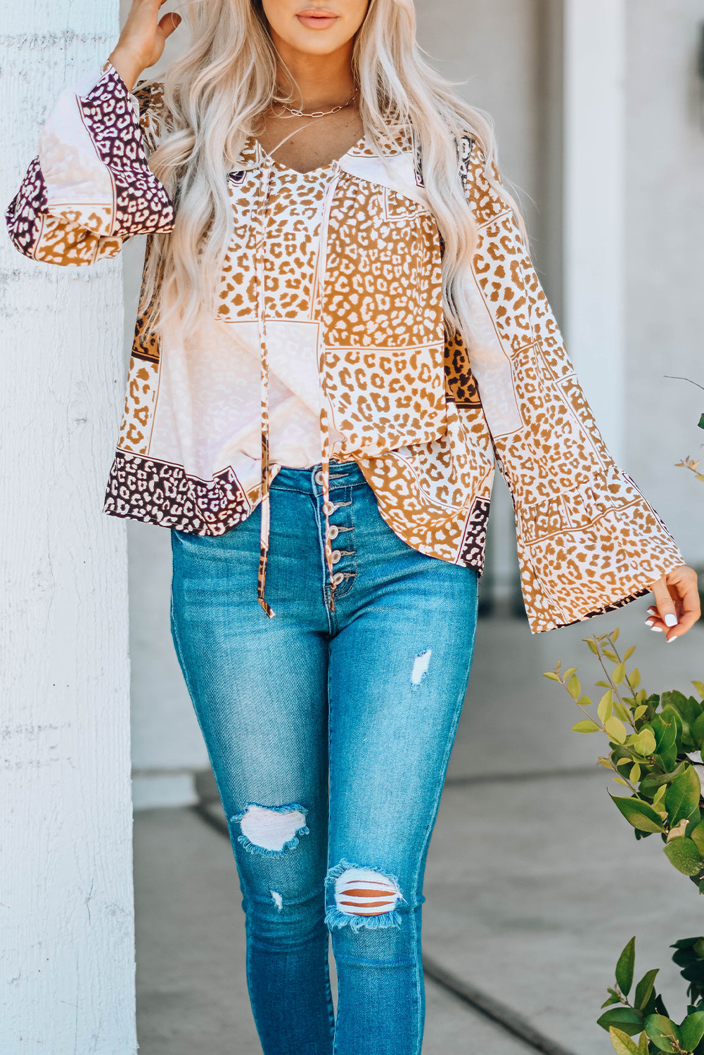 Brown Colorblock Leopard Ribbon Tie Blouse featuring a V-neck and long sleeves, designed for a relaxed fit.