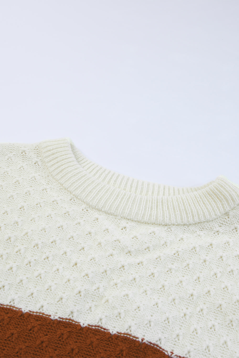 A stylish brown geometric texture colorblock sweater featuring a unique design, perfect for winter wear.