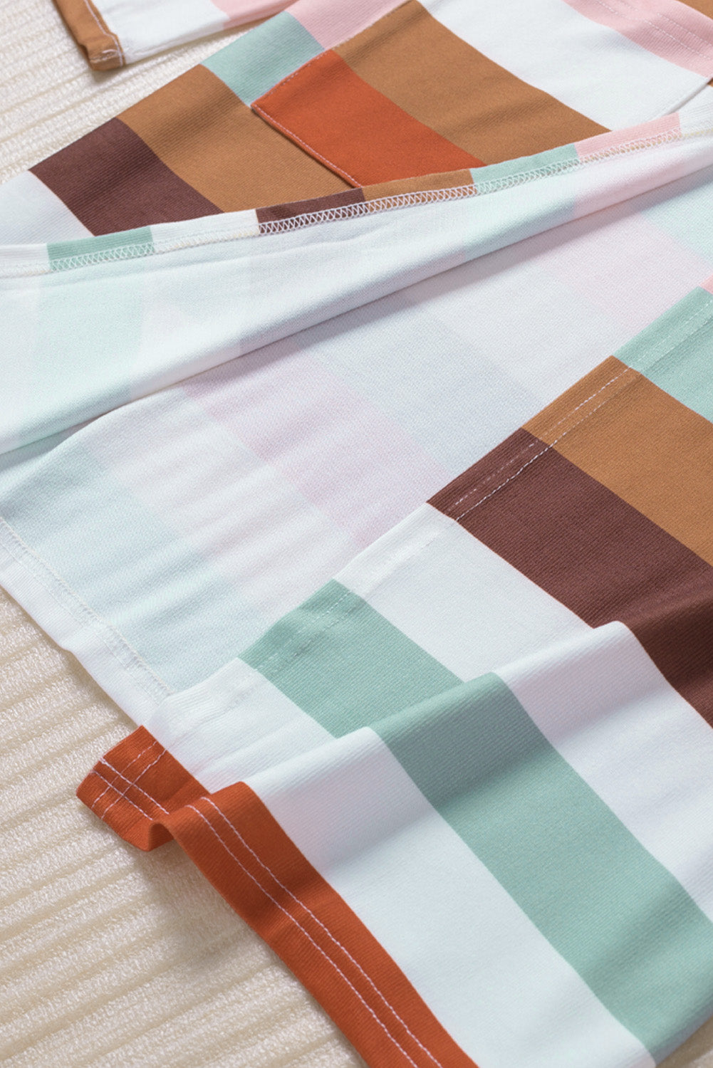 Brown stripe print open front plus size cardigan with pockets, showcasing a stylish design and lightweight knit fabric.