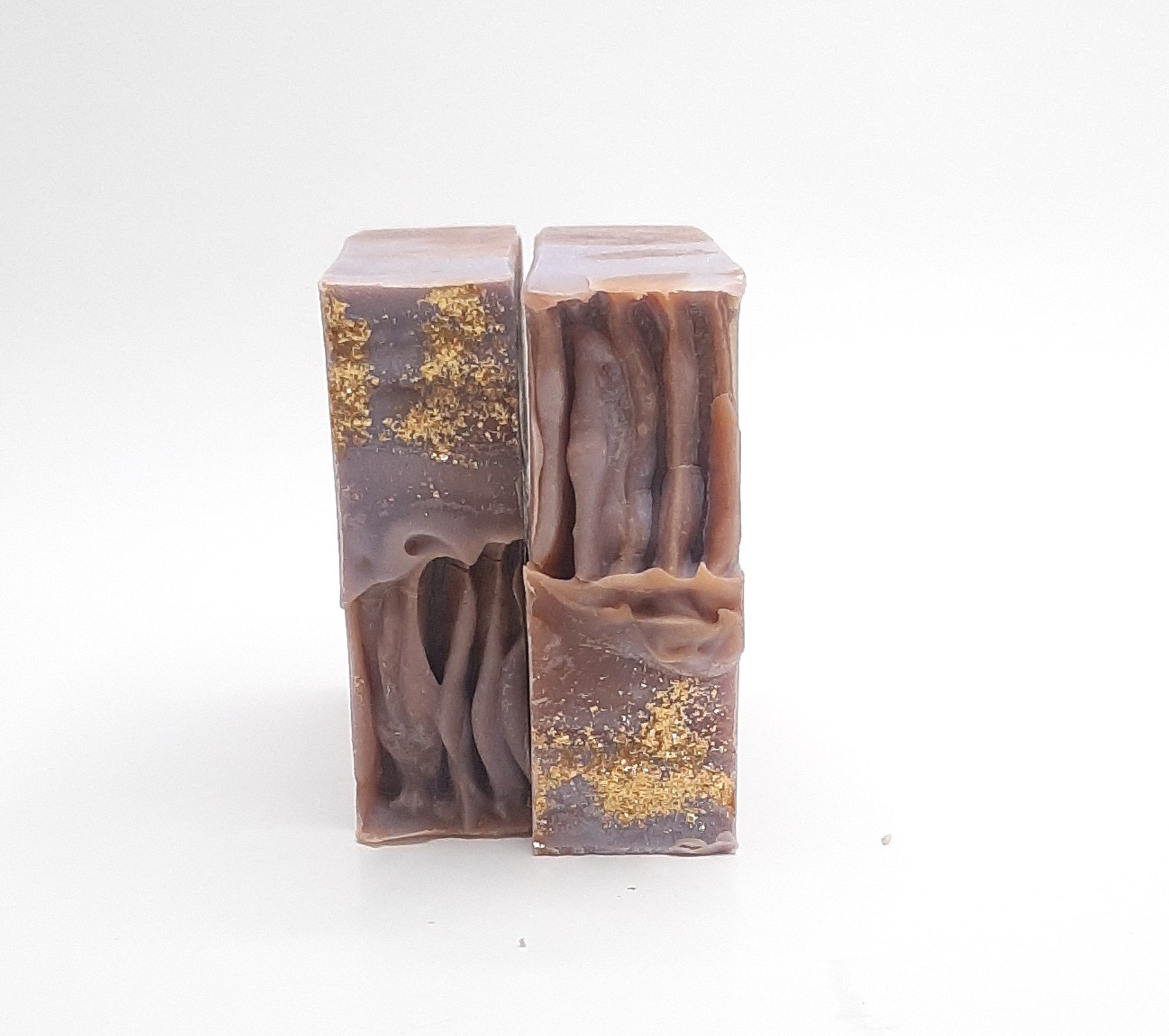 Brown Sugar and Fig Artisan Soap bar with a rich, warm color and gold sparkle on top, beautifully wrapped in eco-friendly kraft paper.