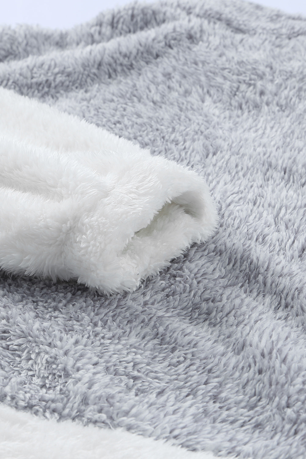 Brown oversized fleece pullover with zip neck and kangaroo pocket, perfect for winter wear.