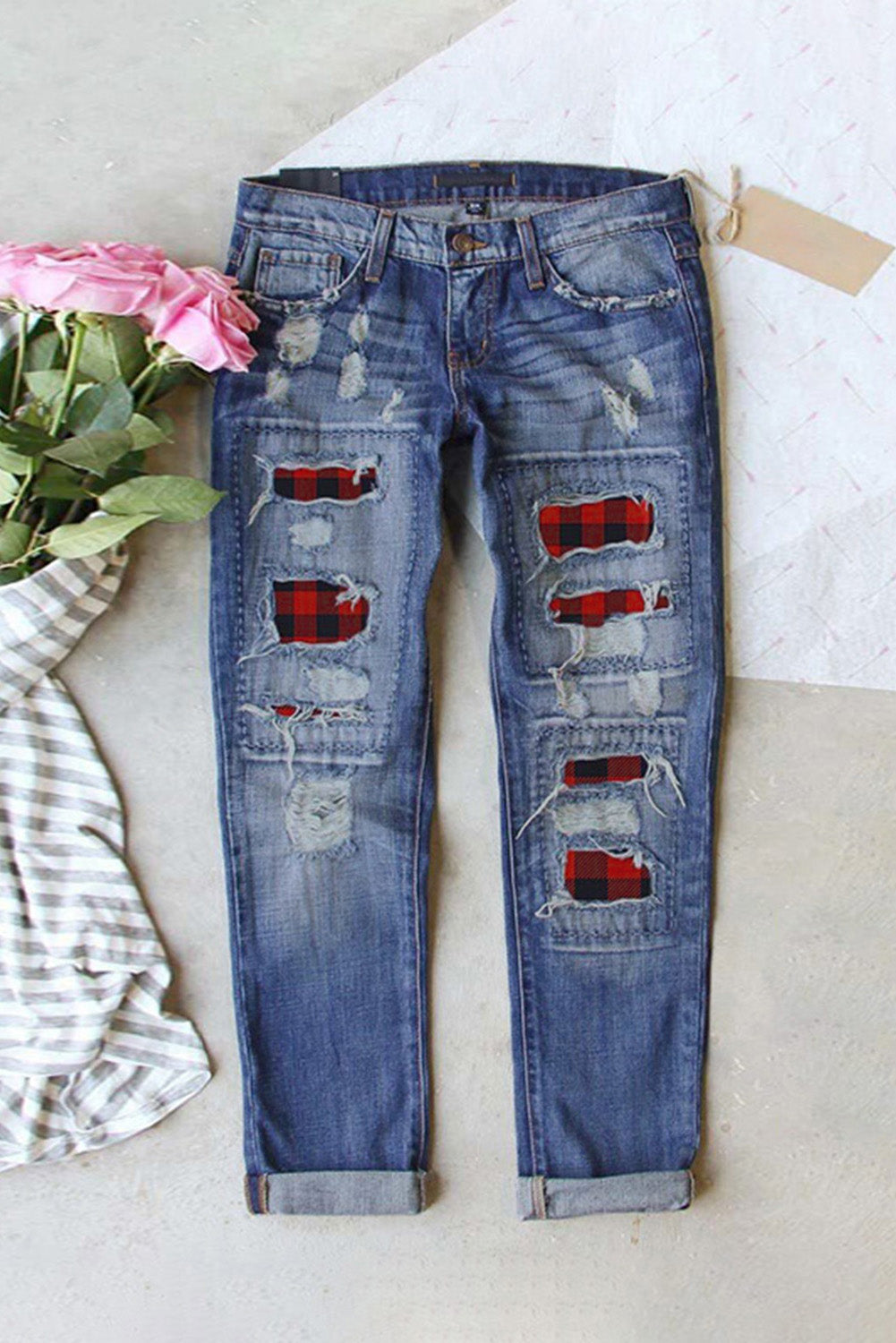 A pair of Buffalo Plaid Patches Distressed Straight Jeans featuring a vintage washed color, stylish buffalo plaid patches, and a distressed design.