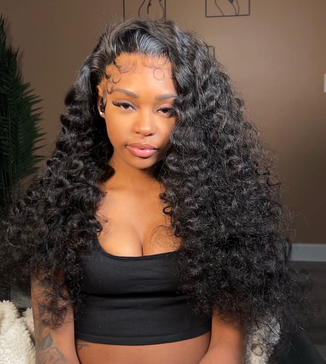Burmese Curly Virgin Hair Bundles showcasing natural black curls, highlighting the quality and texture of the hair extensions.