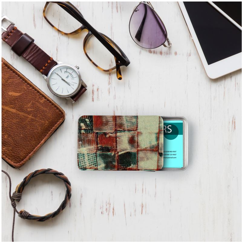 A sleek metallic Business Card Tin holding business cards, featuring a printed design on the lid.