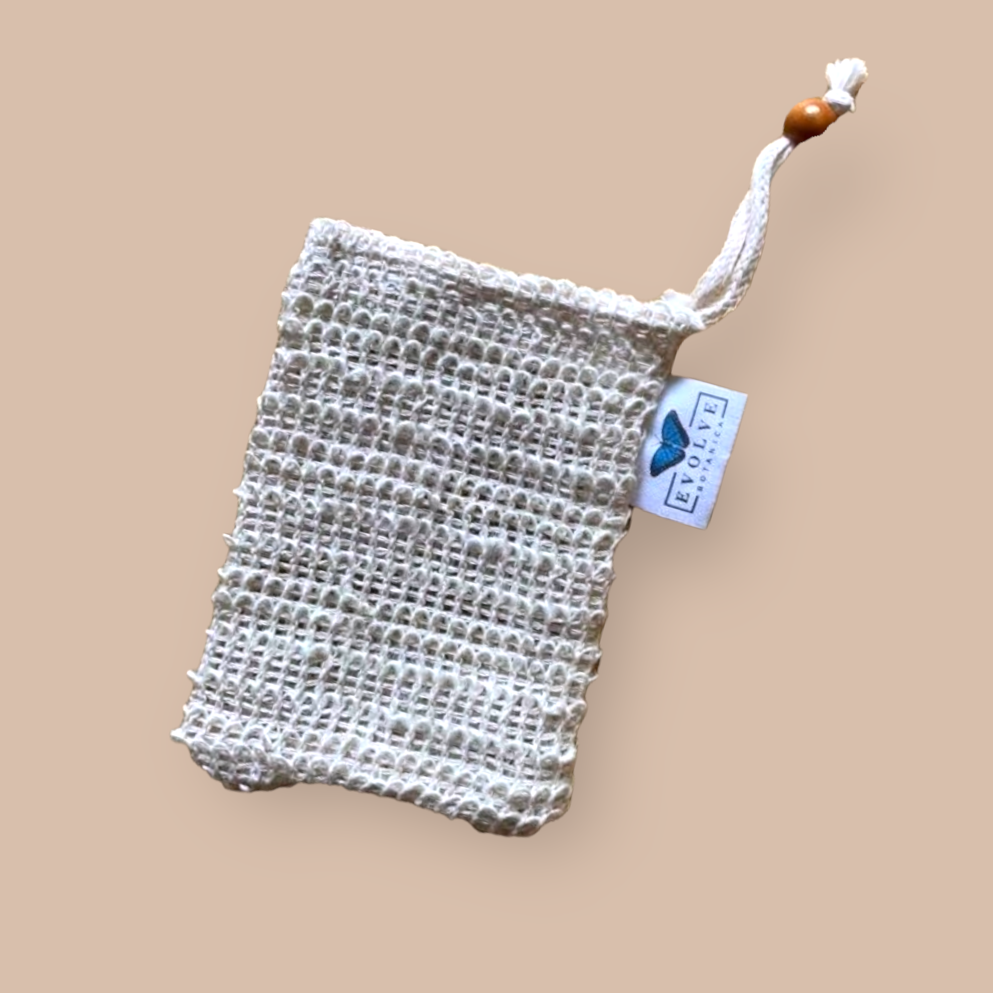 Cambric Exfoliating Soap Saver Mitts in natural fiber, showcasing drawstring closure and texture.