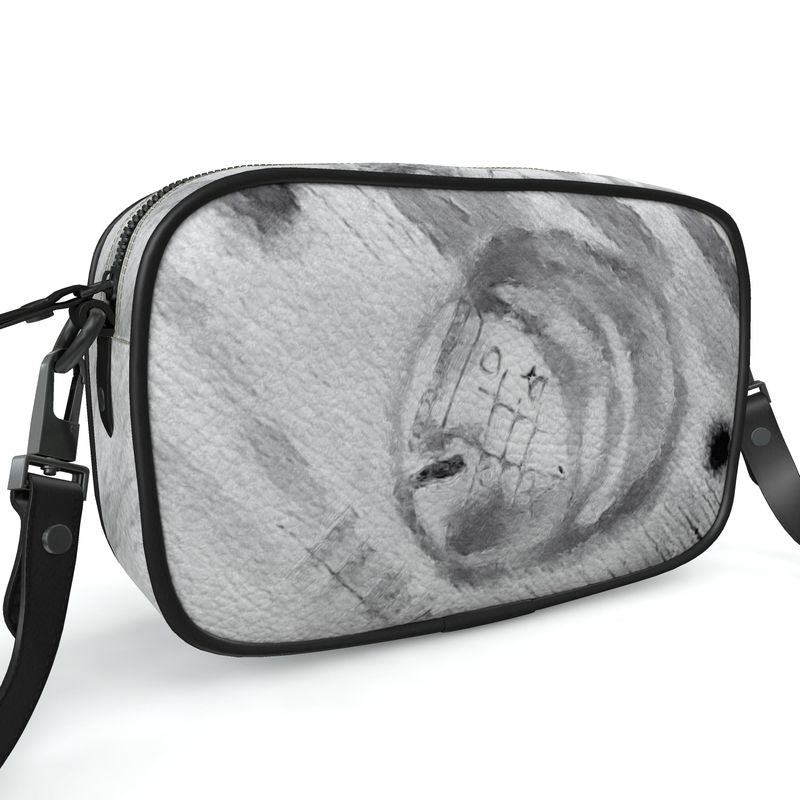 A stylish Designer Camera Bag made from 100% Nappa leather with unique printed designs and black piping.