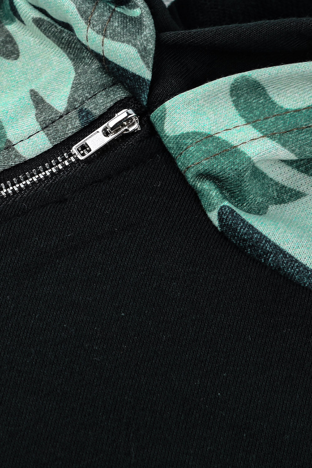 A stylish camouflage print raglan sleeve hoodie featuring a double hood and thumb holes, perfect for modern ladies in fall.