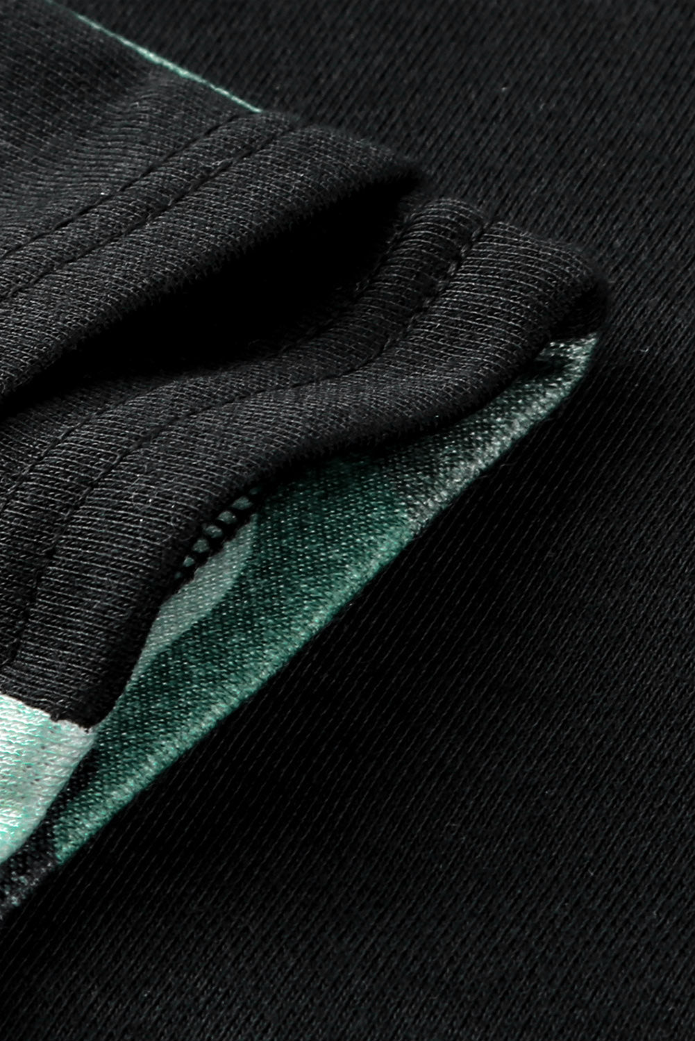 A stylish camouflage print raglan sleeve hoodie featuring a double hood and thumb holes, perfect for modern ladies in fall.