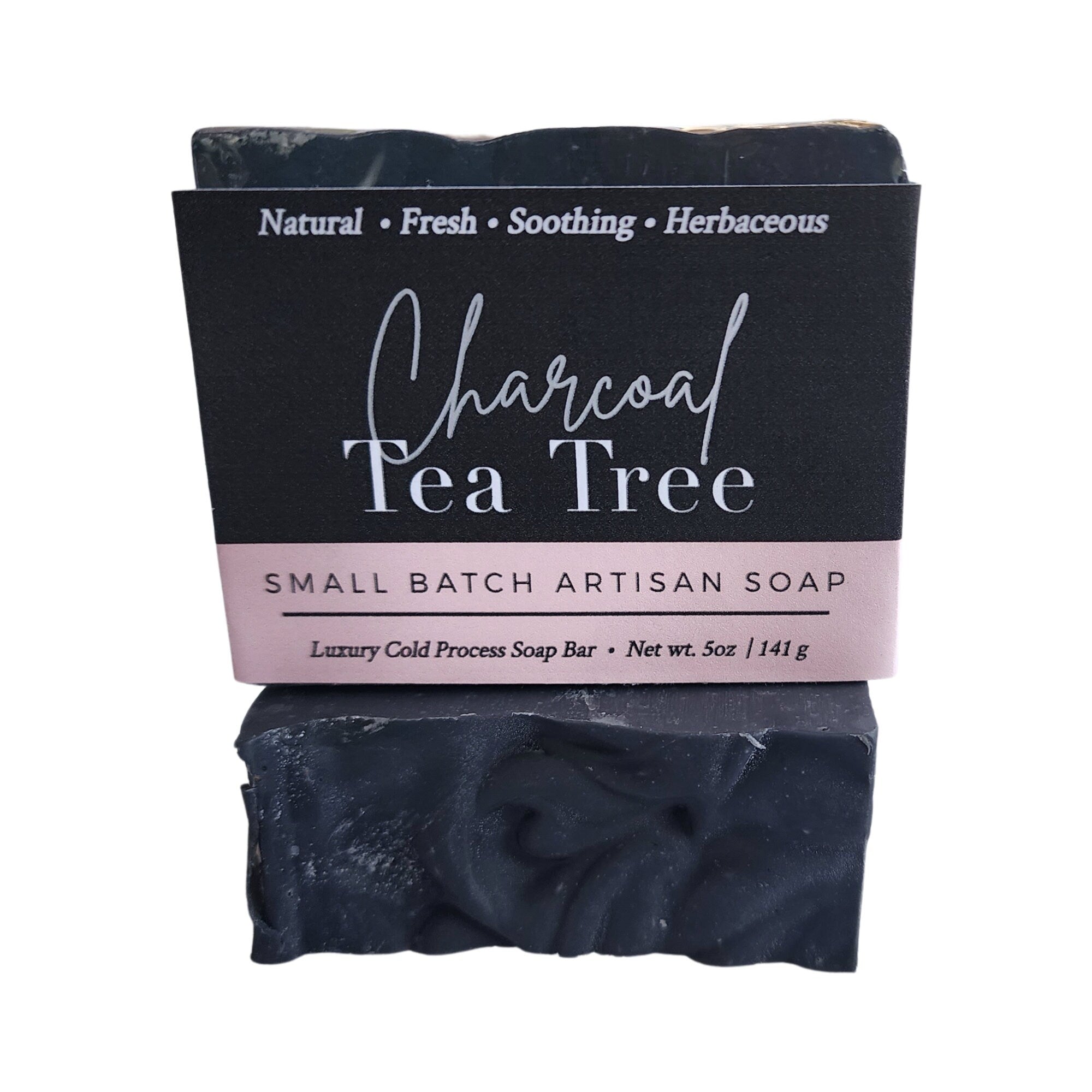 Charcoal Tea Tree Soap bar with activated charcoal and tea tree oil, showcasing its rich texture and natural ingredients.
