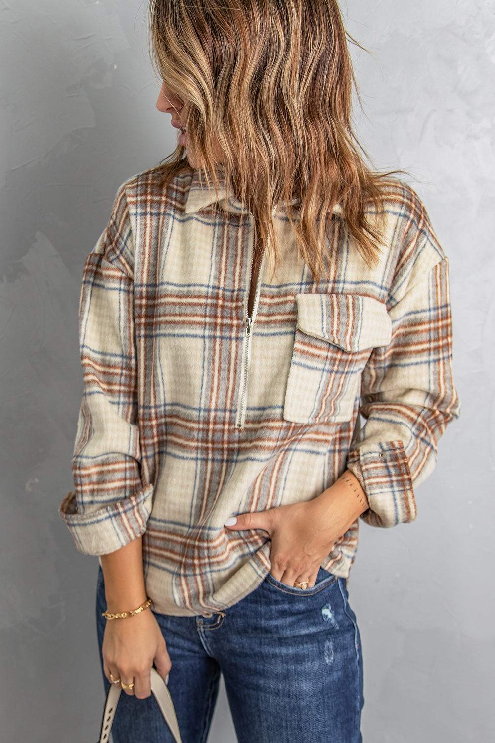 A stylish Chest Pocket Plaid Half Zip Sweatshirt featuring an oversized fit and a chic plaid pattern, perfect for outdoor activities.
