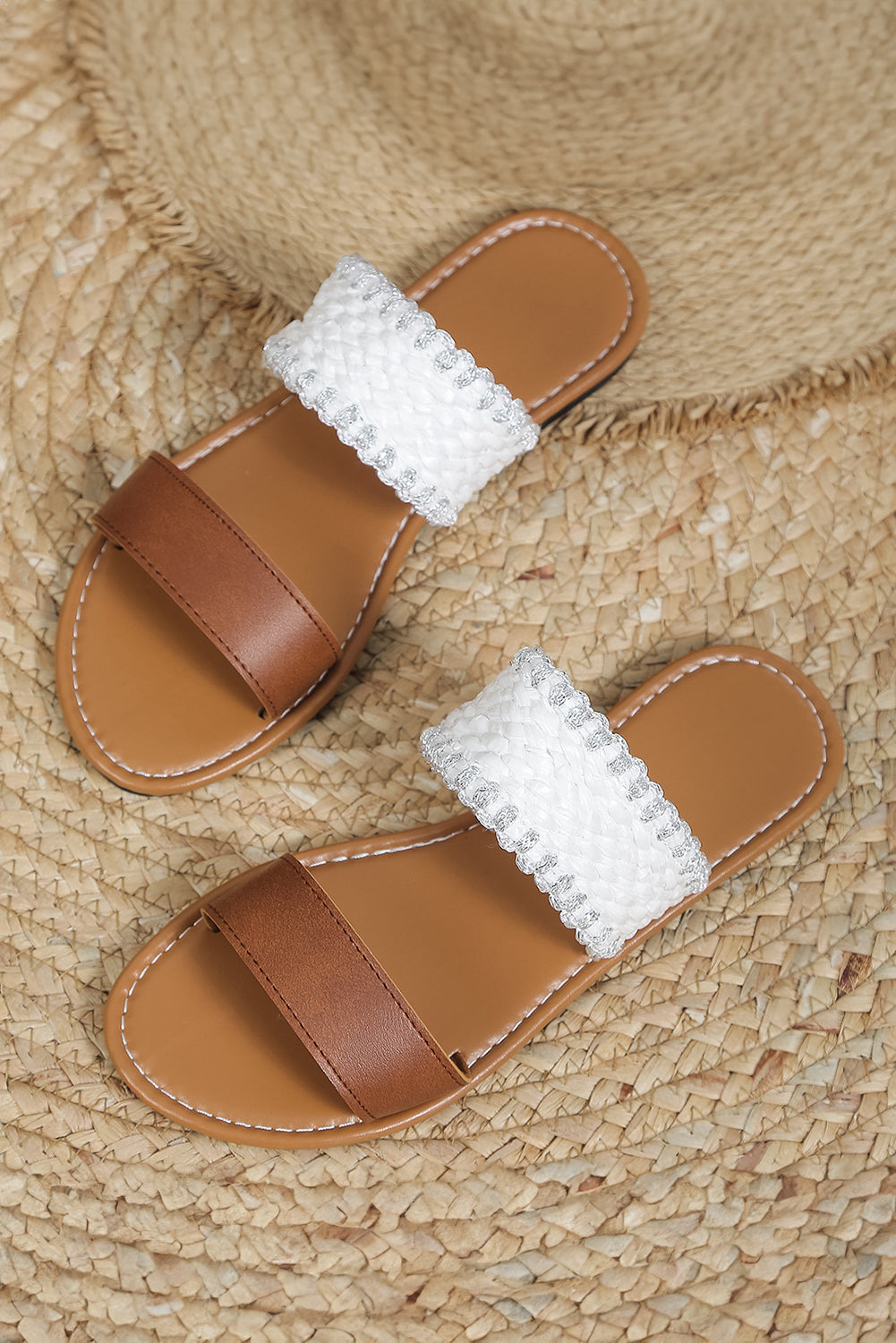 Chestnut faux leather flat slippers with woven strap design, showcasing comfort and style.