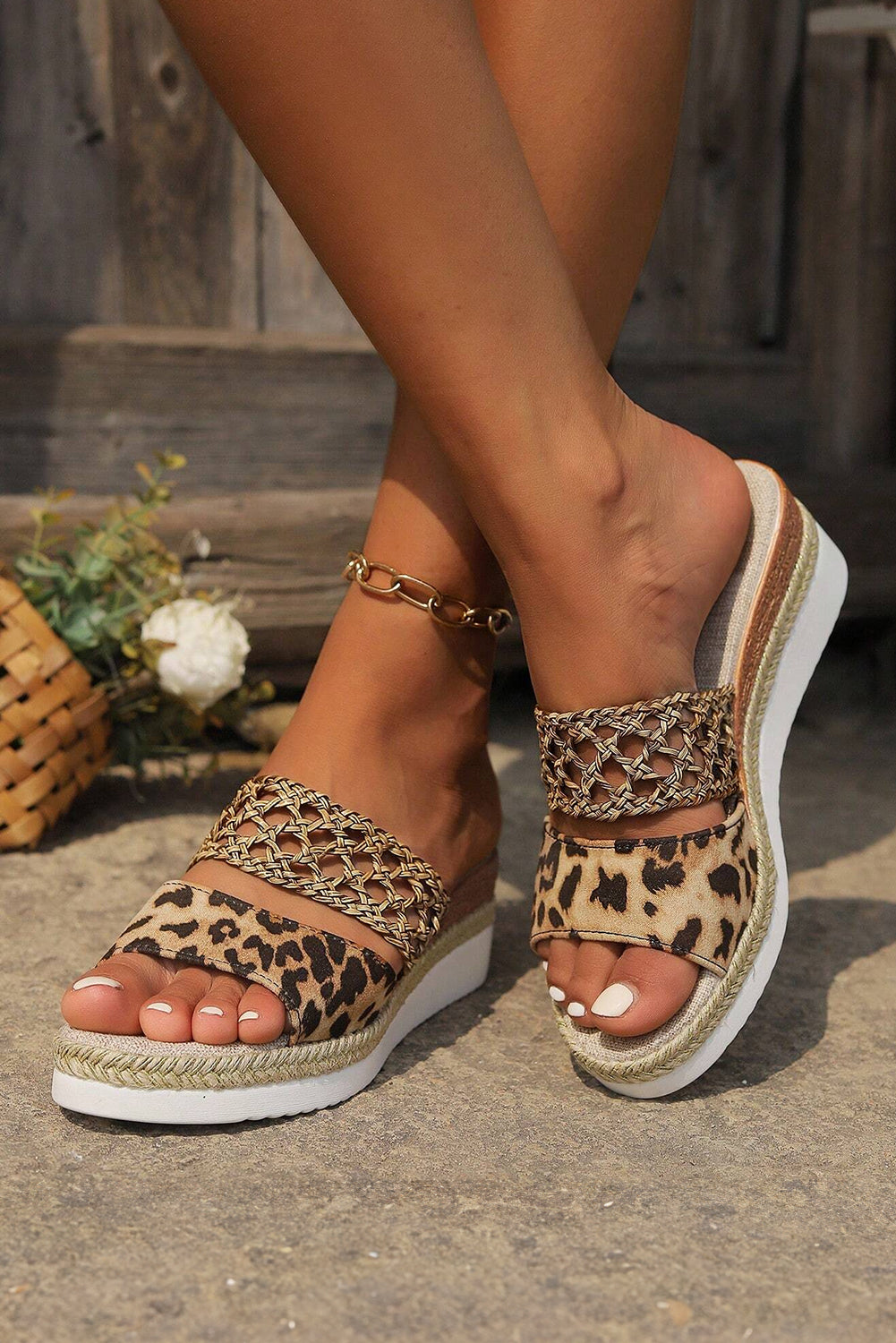 Chestnut leopard print wedge slippers with braided details, showcasing a stylish and comfortable design.