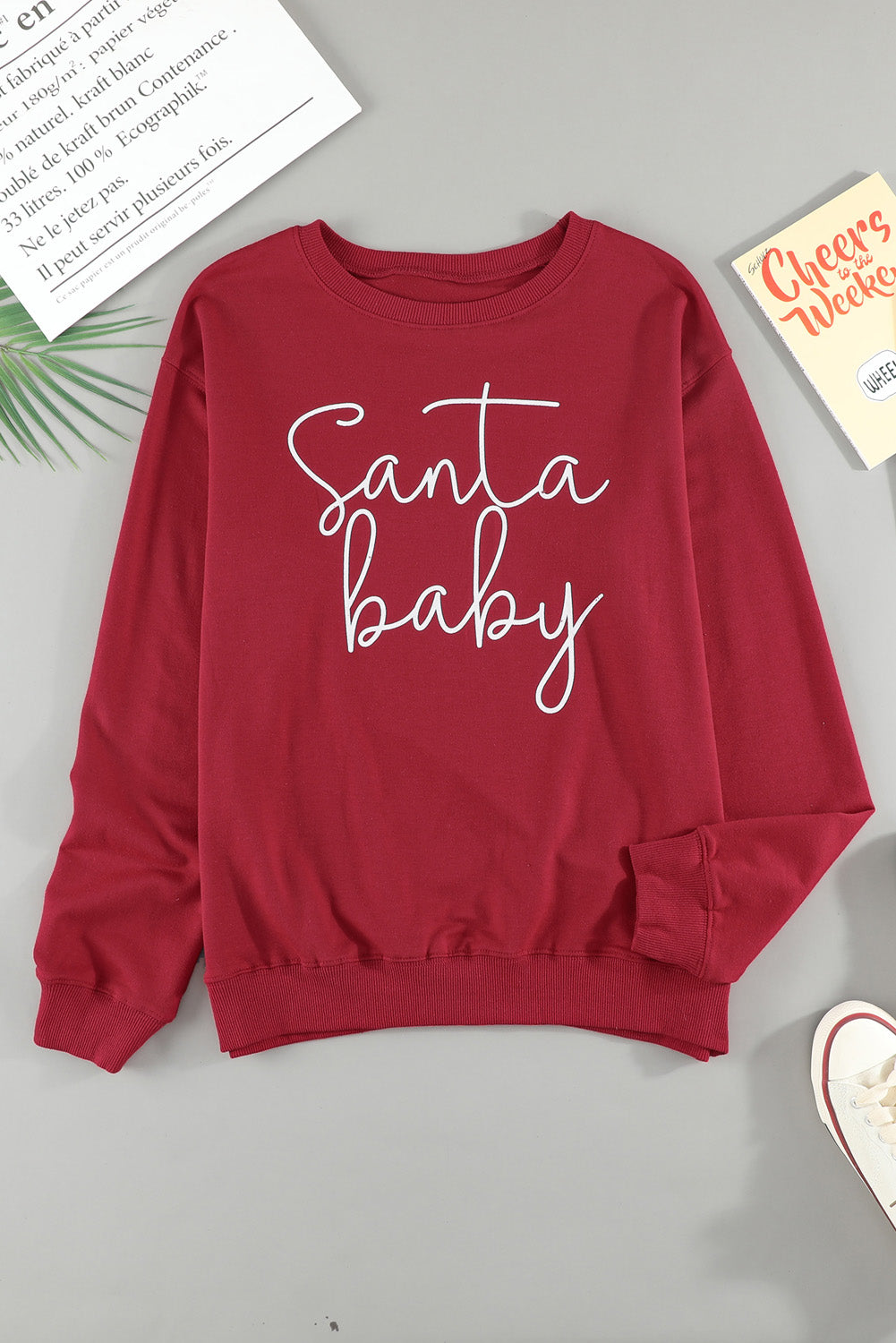 A cozy Christmas Santa Baby Print Pullover Sweatshirt featuring a festive design, long sleeves, and a relaxed fit, perfect for holiday celebrations.