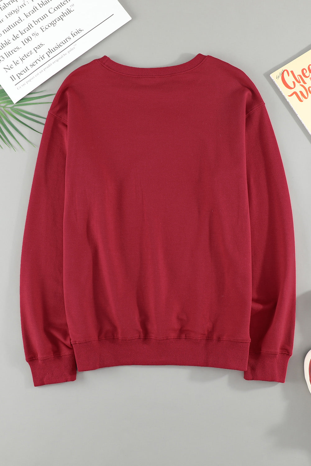 A cozy Christmas Santa Baby Print Pullover Sweatshirt featuring a festive design, long sleeves, and a relaxed fit, perfect for holiday celebrations.