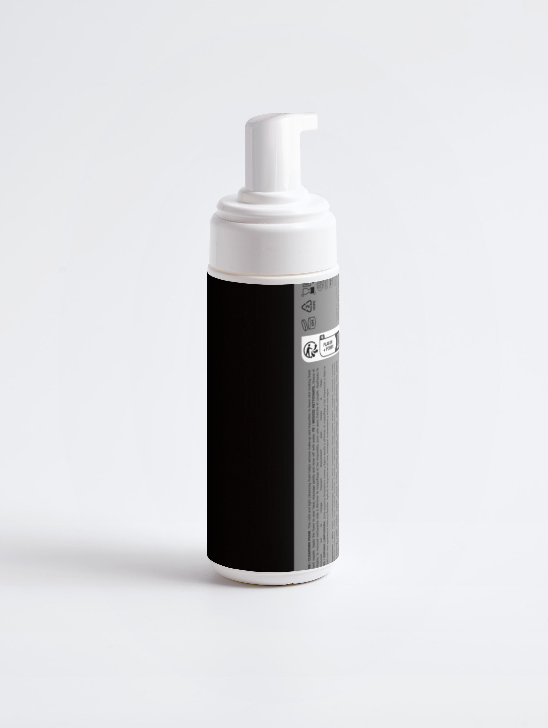 A bottle of Cleansing Foam with a white label, showcasing its natural ingredients like Rose Flower Water and Chamomile Extract.