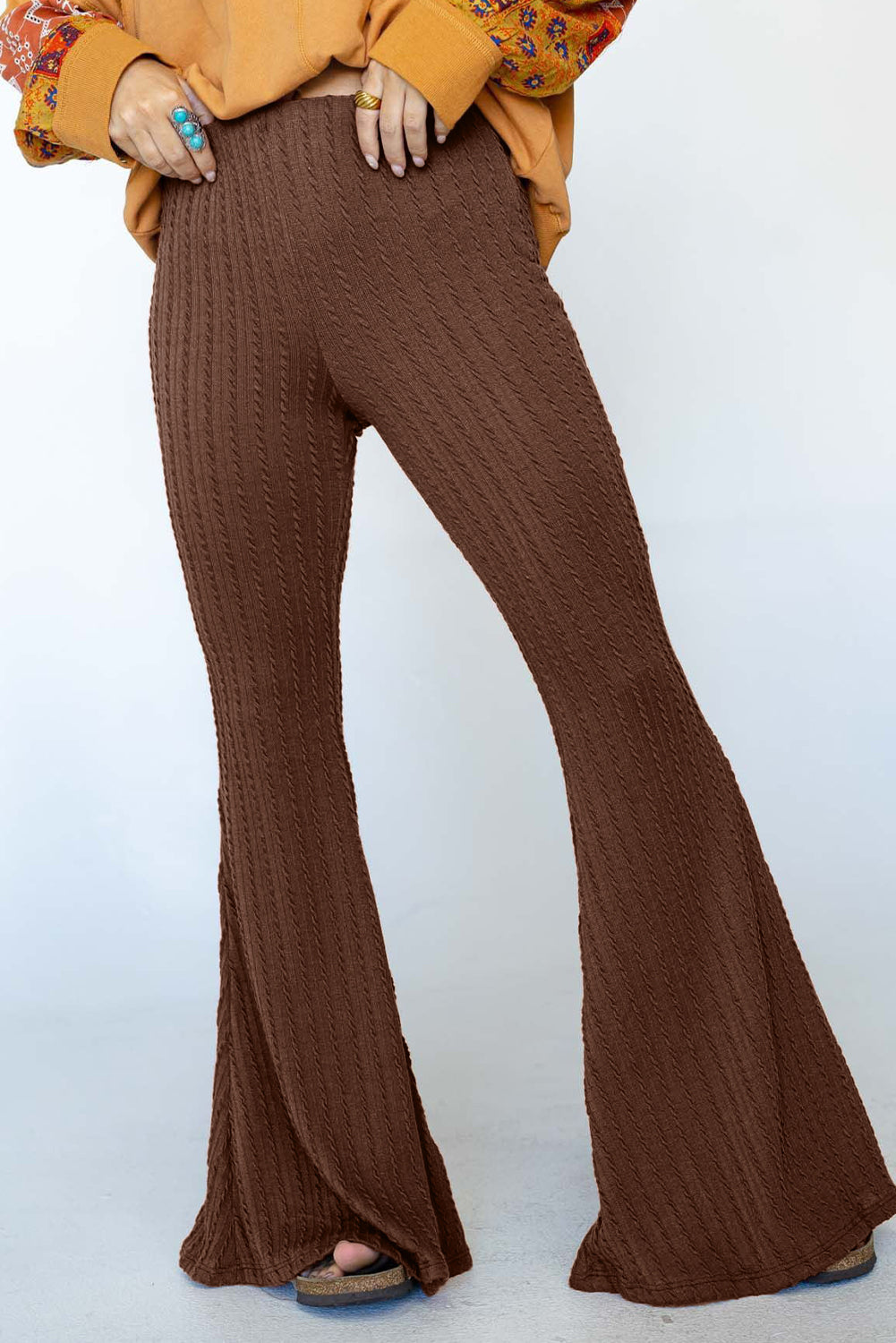 Coffee Textured Knit Mid Waist Flare Pants showcasing a stylish bell bottom design and unique textured fabric.