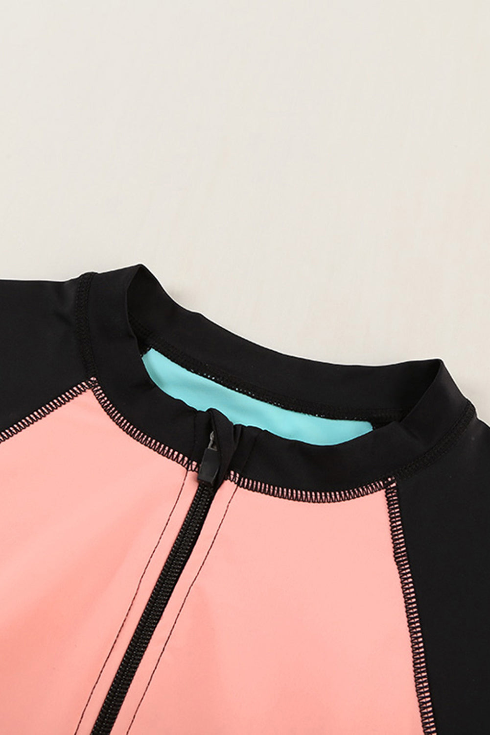 Color Zip Up Neckline Color Block Rashguard Top for women, featuring a stylish design with long sleeves and a zip front.
