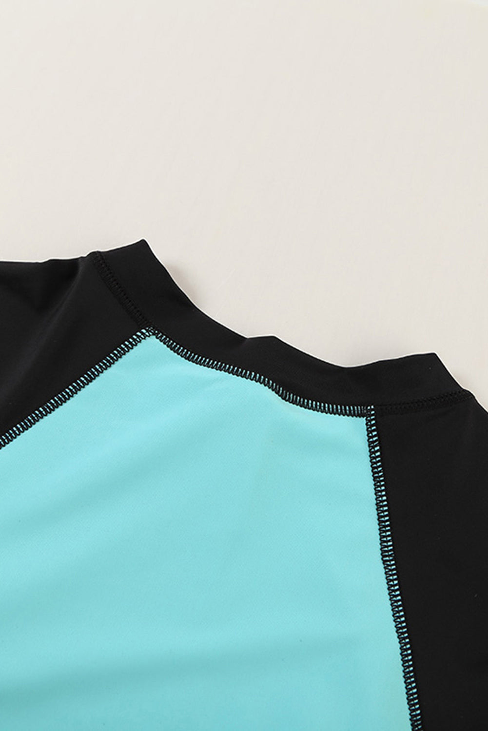 Color Zip Up Neckline Color Block Rashguard Top for women, featuring a stylish design with long sleeves and a zip front.