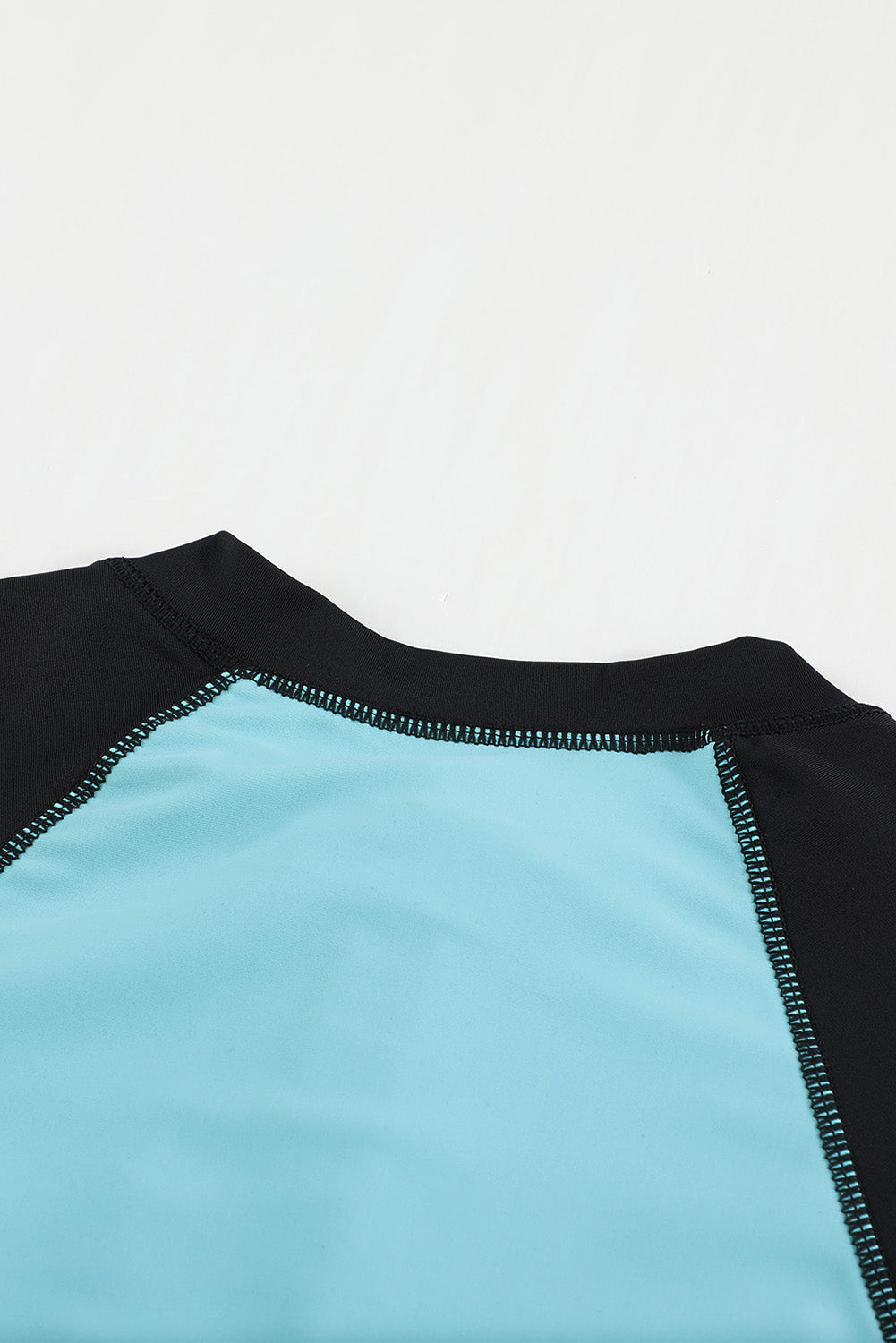 Color Zip Up Neckline Color Block Rashguard Top for women, featuring a stylish design with long sleeves and a zip front.