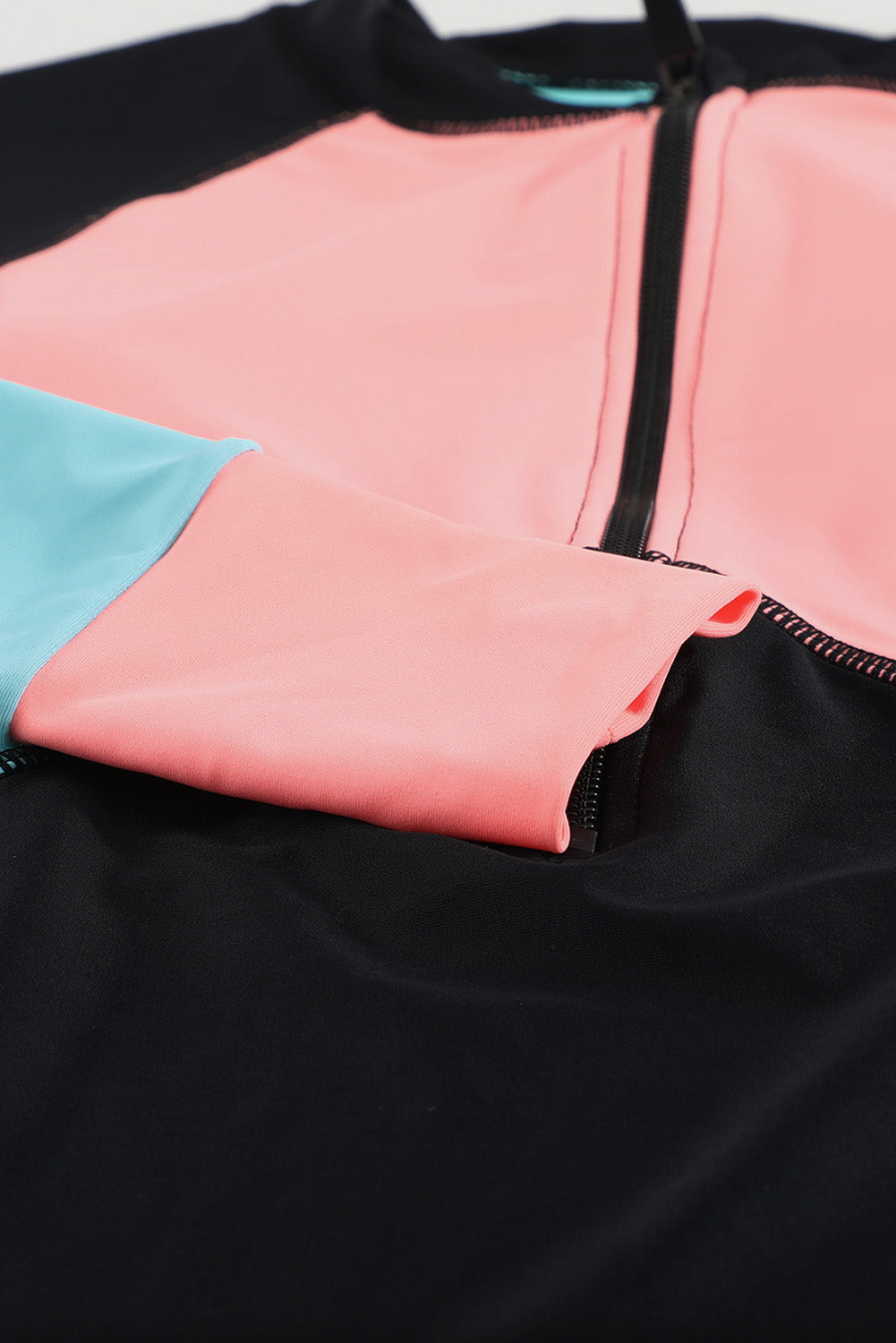 Color Zip Up Neckline Color Block Rashguard Top for women, featuring a stylish design with long sleeves and a zip front.