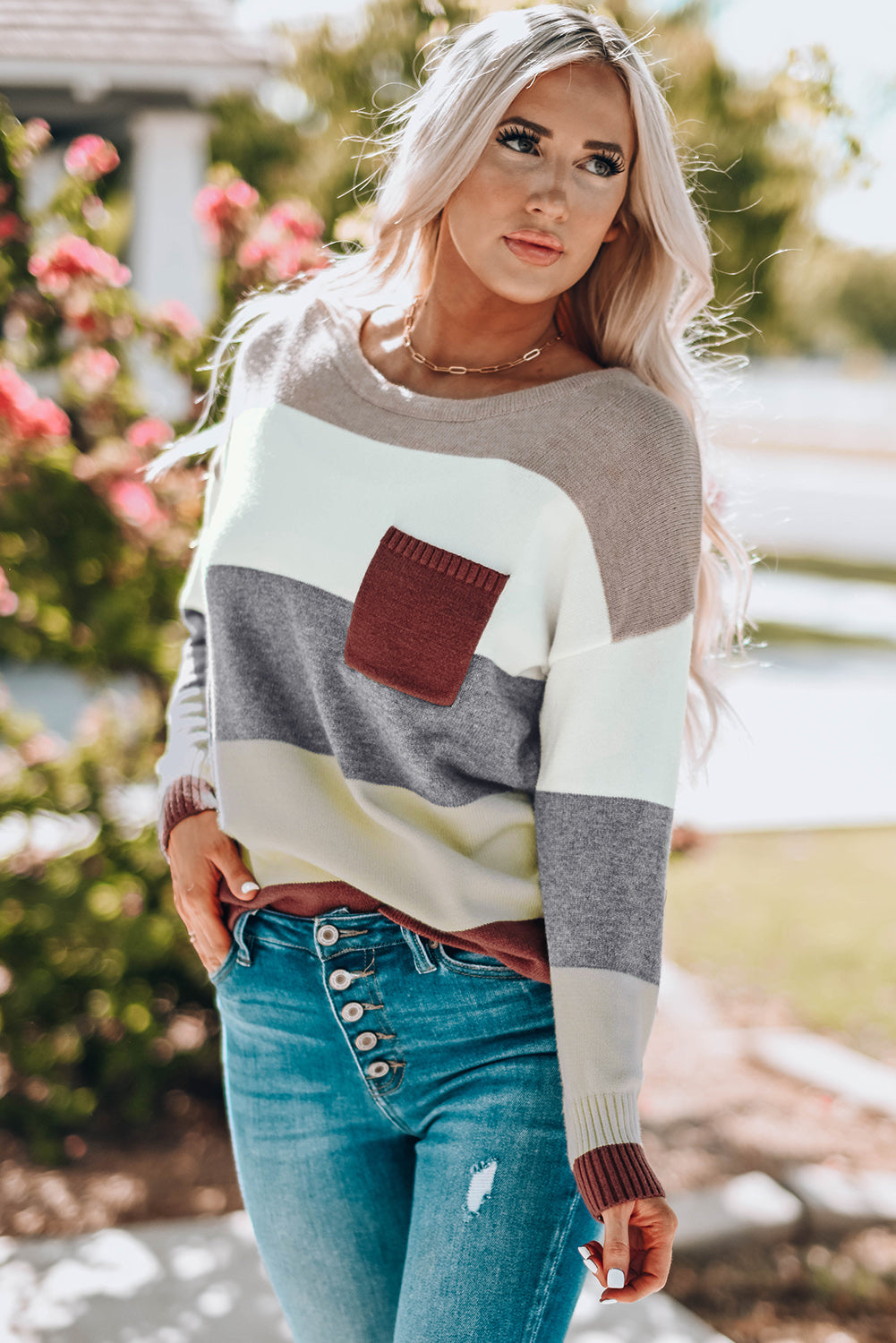 A stylish Colorblock Pocketed Sweater featuring a longline silhouette, vibrant color blocks, and convenient pockets, perfect for casual wear.