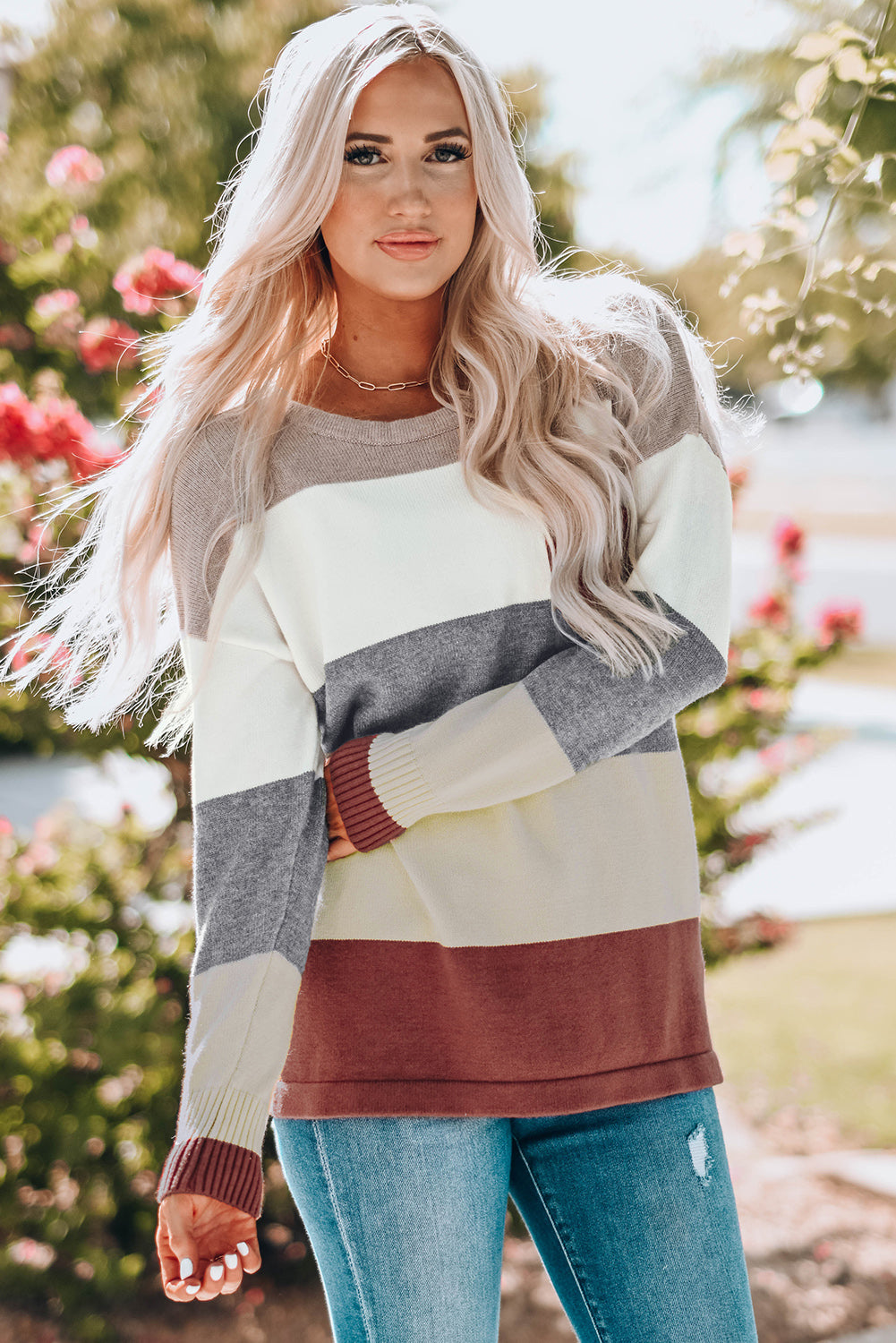 A stylish Colorblock Pocketed Sweater featuring a longline silhouette, vibrant color blocks, and convenient pockets, perfect for casual wear.