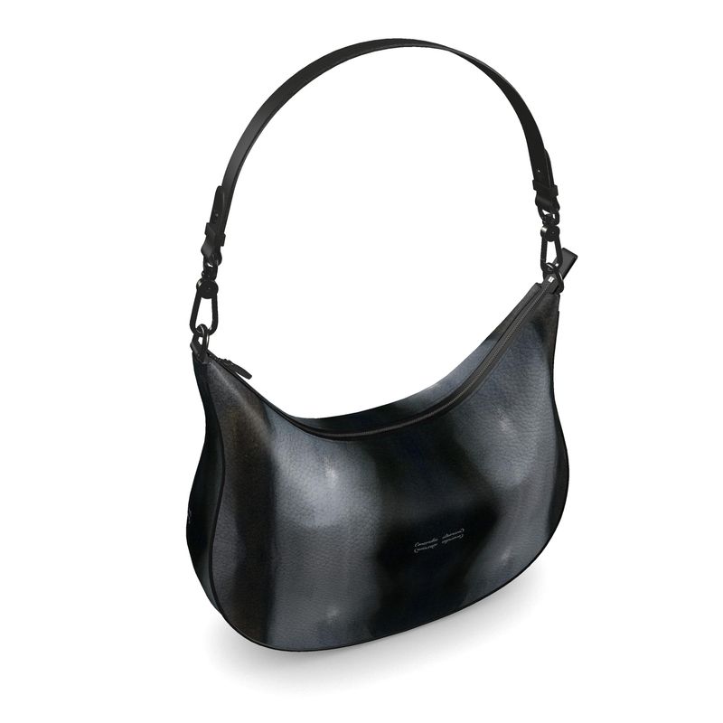 Curve Hobo Bag made from full-grain Nappa leather with faux suede lining, featuring two internal pockets.