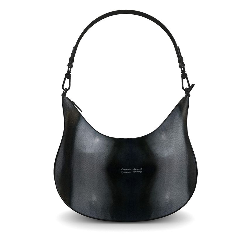 Curve Hobo Bag made from full-grain Nappa leather with faux suede lining, featuring two internal pockets.