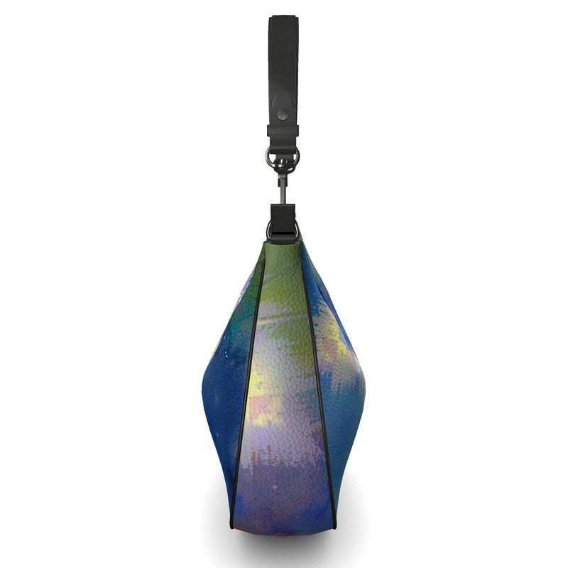 Curve Hobo Bag made of full-grain Nappa leather with a faux suede lining, featuring a unique curved design and internal pockets.