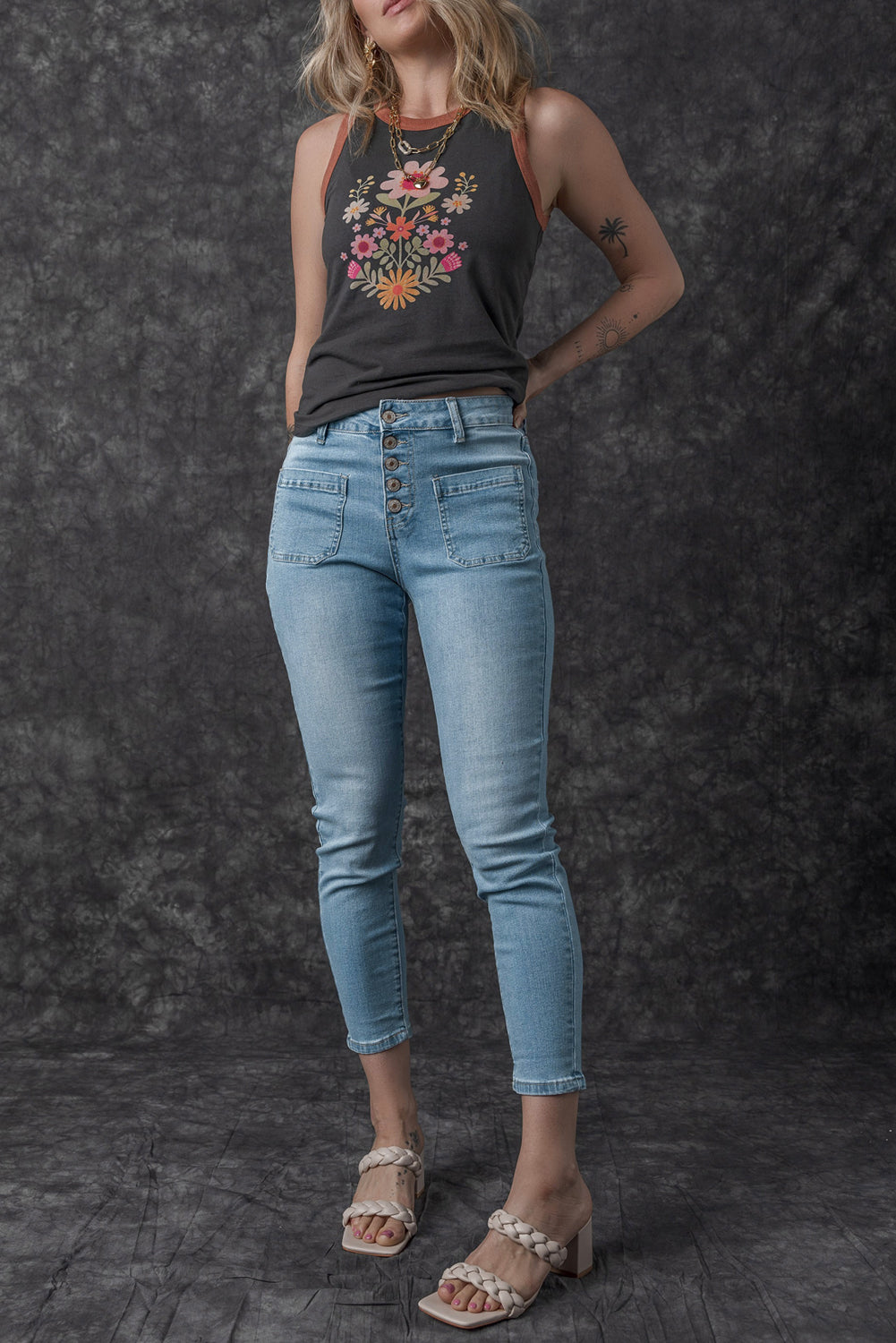 Dark blue skinny jeans featuring a button fly closure and pockets, designed for a stylish and comfortable fit.