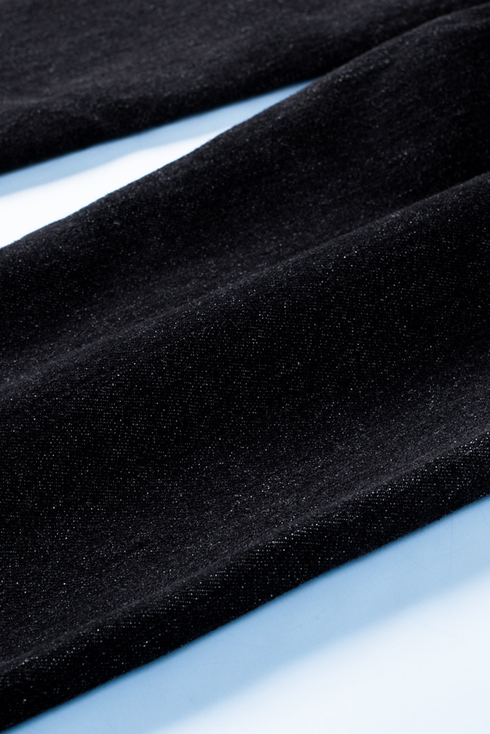 Dark blue skinny jeans featuring a button fly closure and pockets, designed for a stylish and comfortable fit.