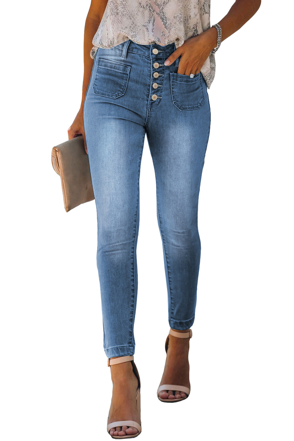 Dark blue skinny jeans featuring a button fly closure and pockets, designed for a stylish and comfortable fit.