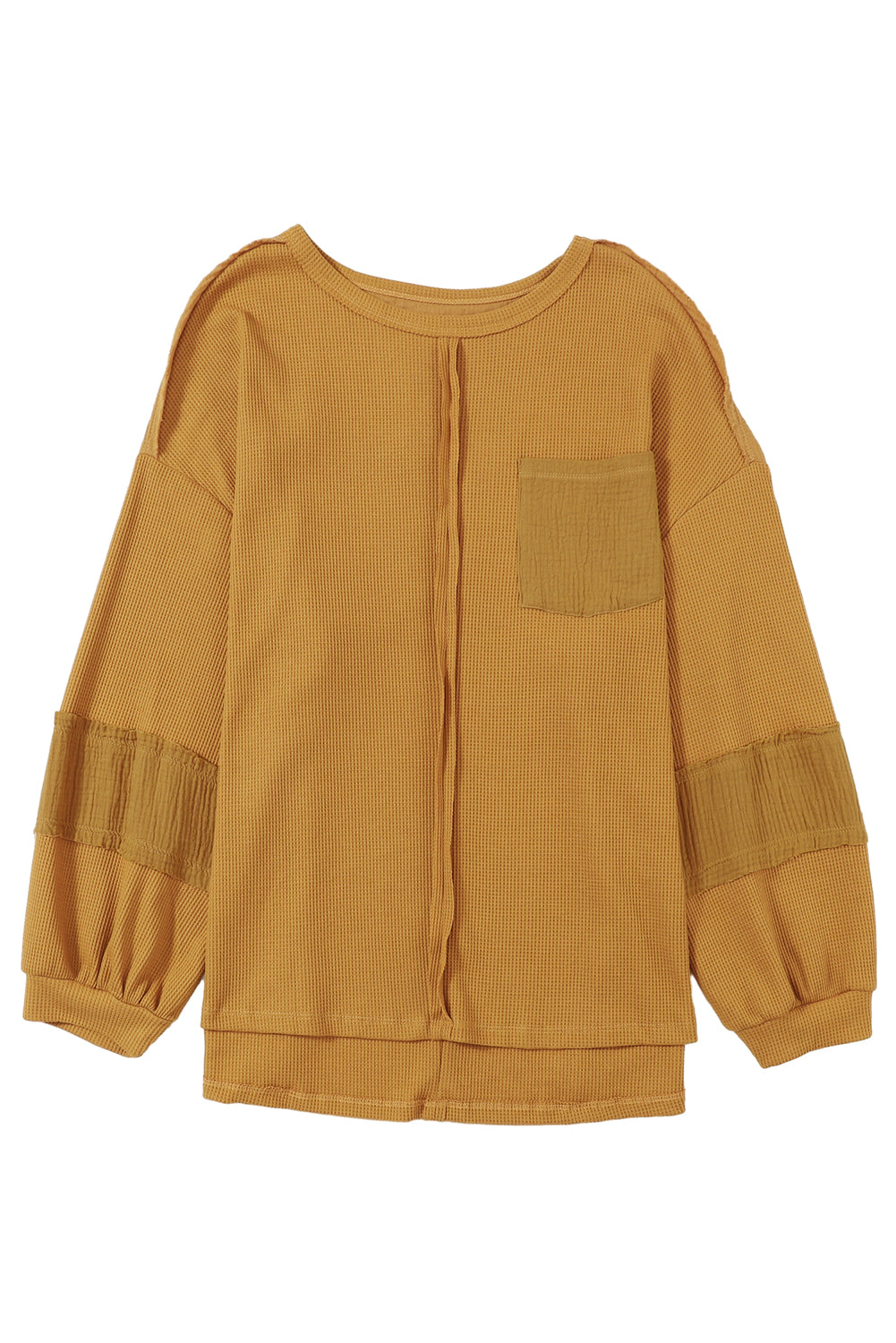 Dark brown waffle knit top with exposed seams and bubble sleeves, featuring a chic patchwork design and front pocket.