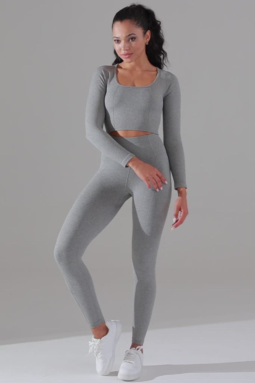 Dark grey high waist yoga leggings with stylish outer seam details, perfect for workouts and casual wear.