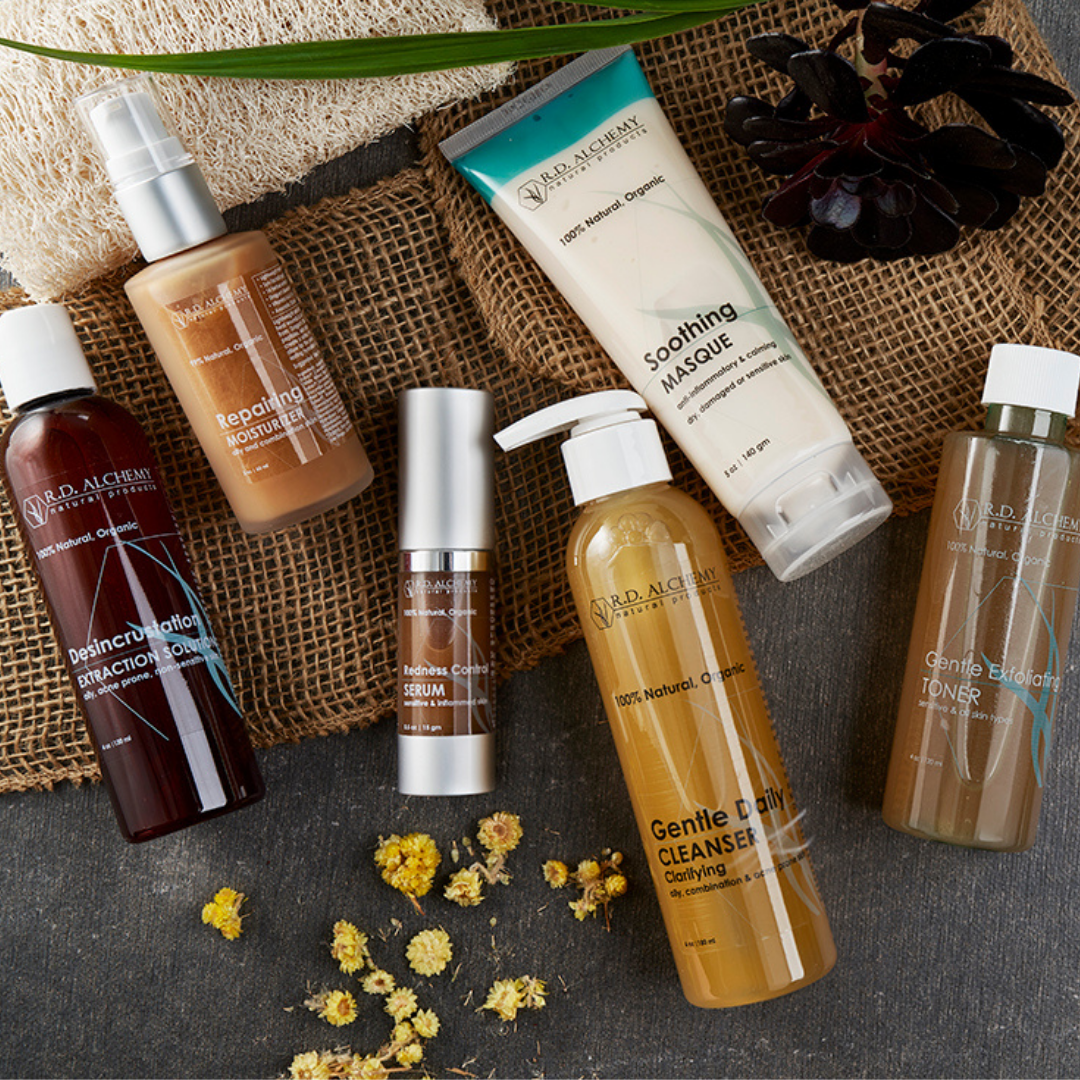 A bottle of Desincrustation Solution for blackhead removal, featuring a sleek design and clear liquid inside, ideal for skincare routines.