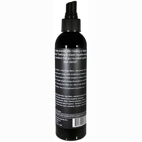 A bottle of ENERGY HEALERS Essential Oil Spray with a calming design, featuring essential oils and gemstones for energy cleansing.