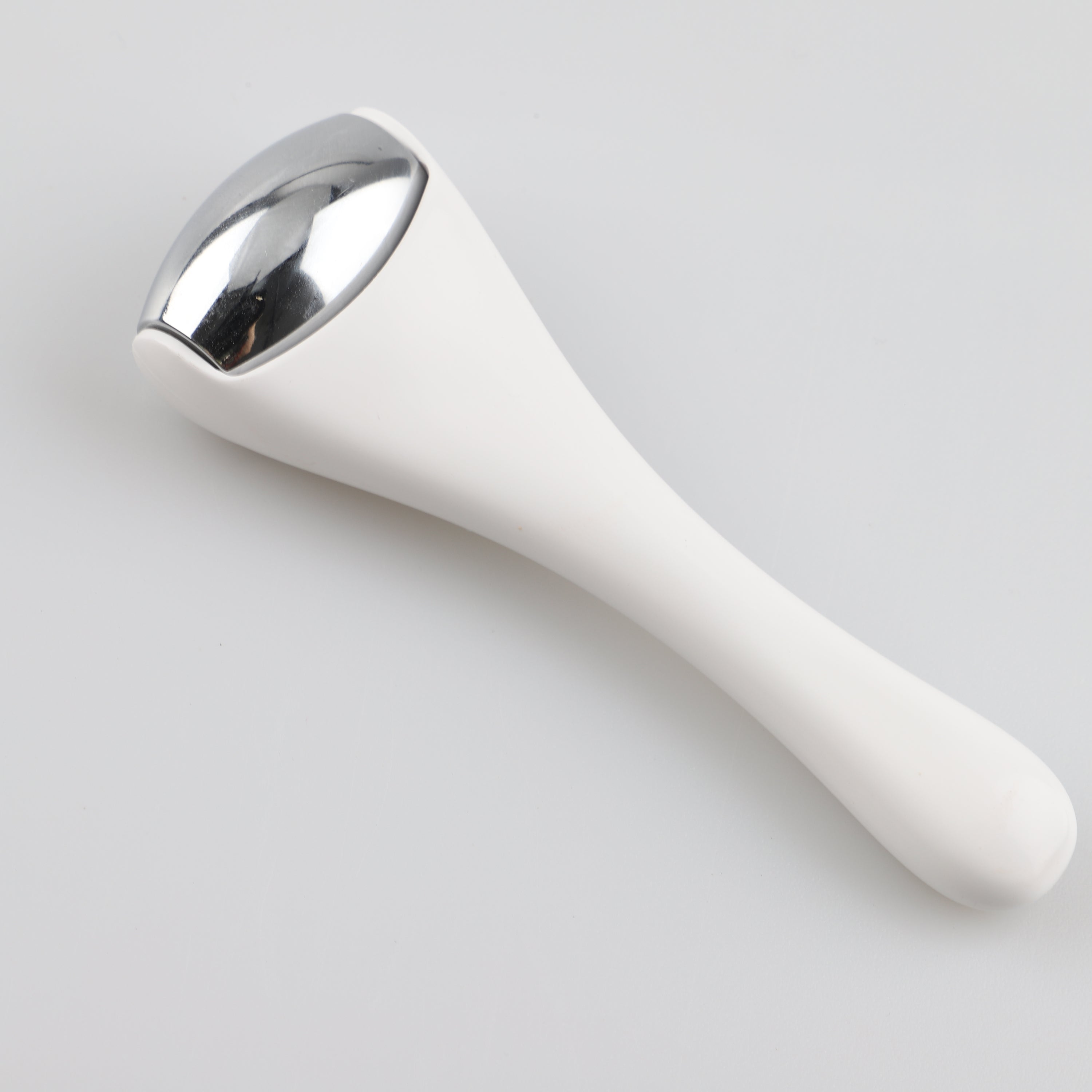 Eye & Face Ice Roller Massager in stainless steel, designed for rejuvenating skin and reducing puffiness.