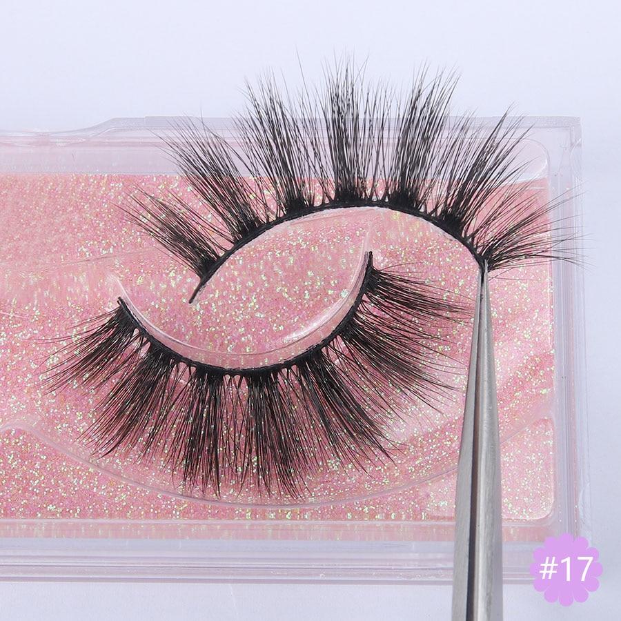 A pair of Faux 3D Mink Eyelashes displayed in a transparent box, showcasing their dramatic and wispy design.