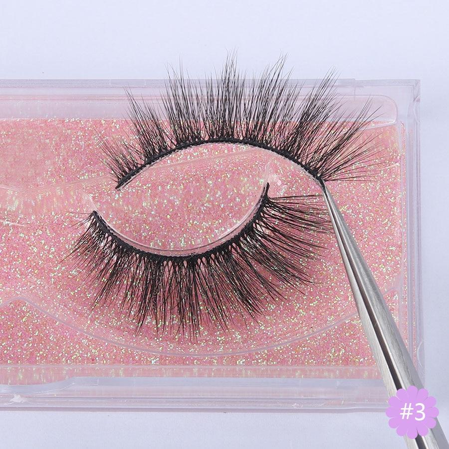 A pair of Faux 3D Mink Eyelashes displayed in a transparent box, showcasing their dramatic and wispy design.