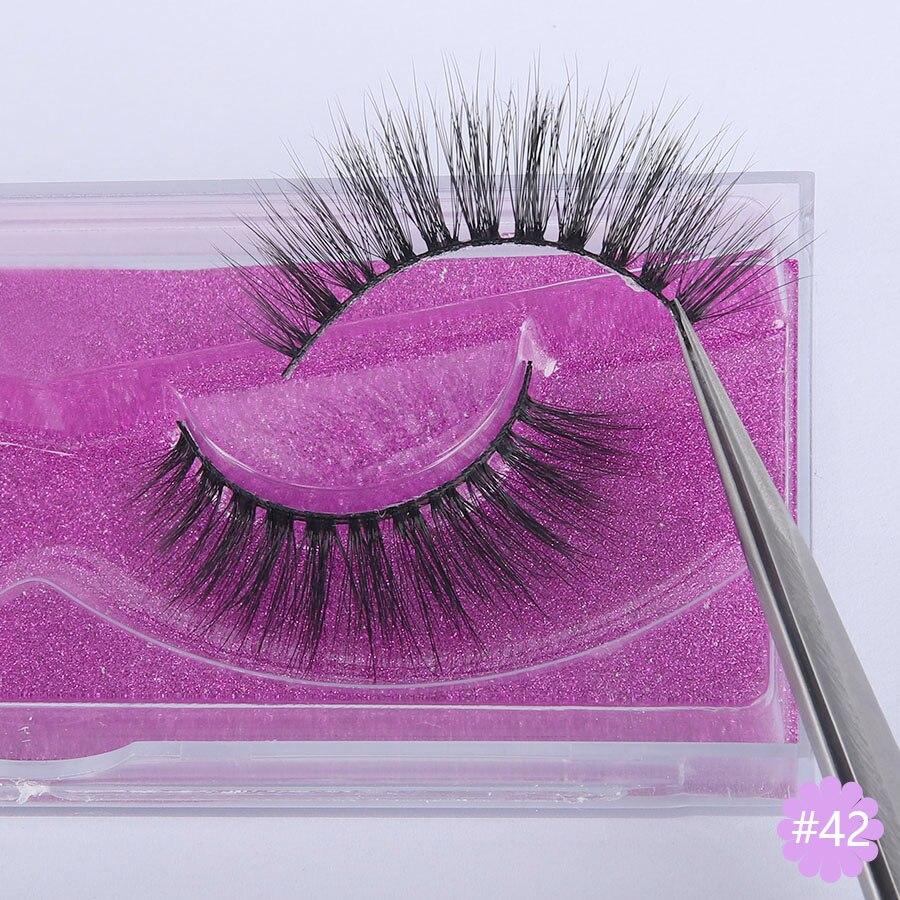 A pair of Faux 3D Mink Eyelashes displayed in a transparent box, showcasing their dramatic and wispy design.