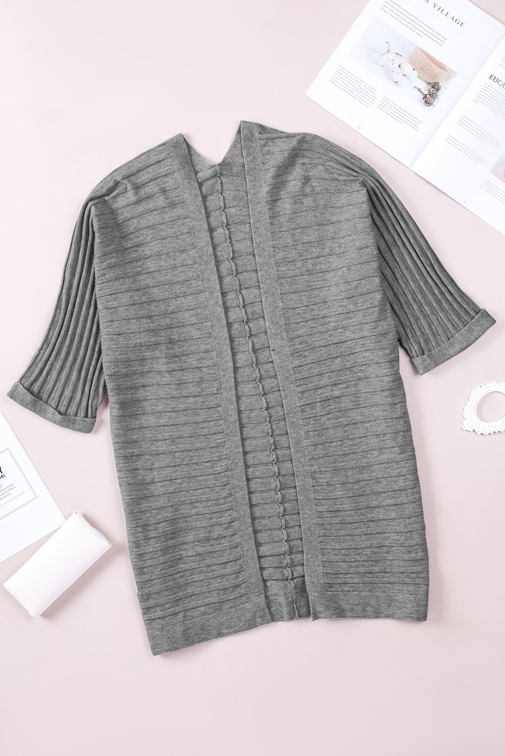 A stylish fiery red ribbed open front knit cardigan with 3/4 sleeves, perfect for layering over casual outfits.