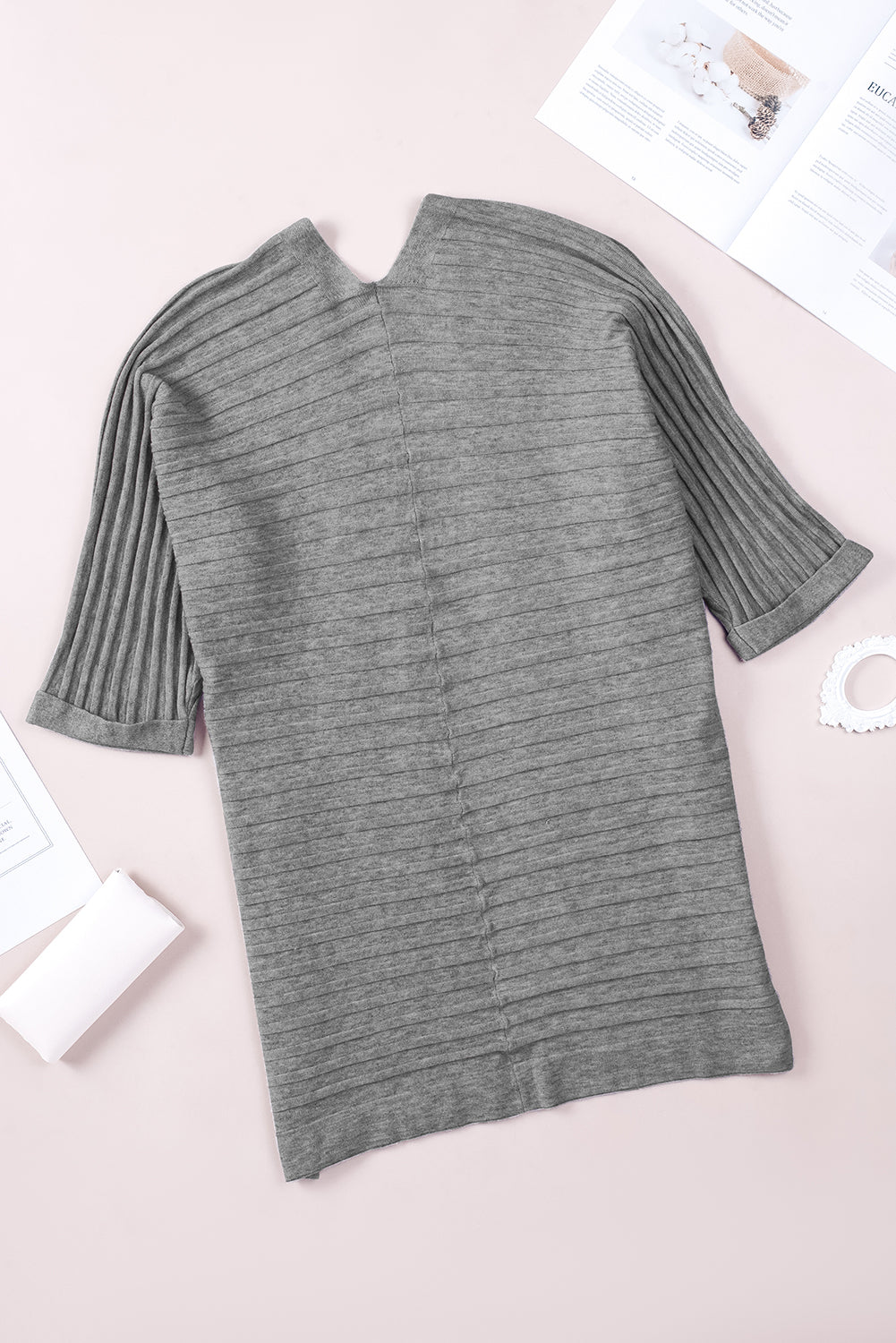 A stylish fiery red ribbed open front knit cardigan with 3/4 sleeves, perfect for layering over casual outfits.