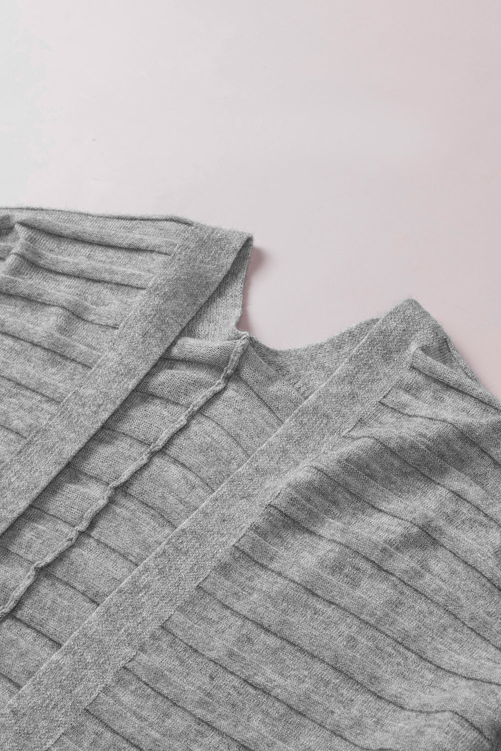 A stylish fiery red ribbed open front knit cardigan with 3/4 sleeves, perfect for layering over casual outfits.