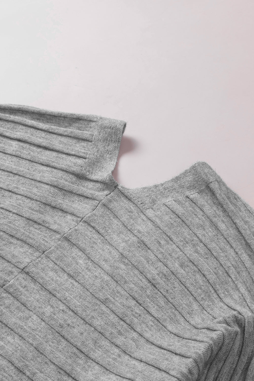 A stylish fiery red ribbed open front knit cardigan with 3/4 sleeves, perfect for layering over casual outfits.