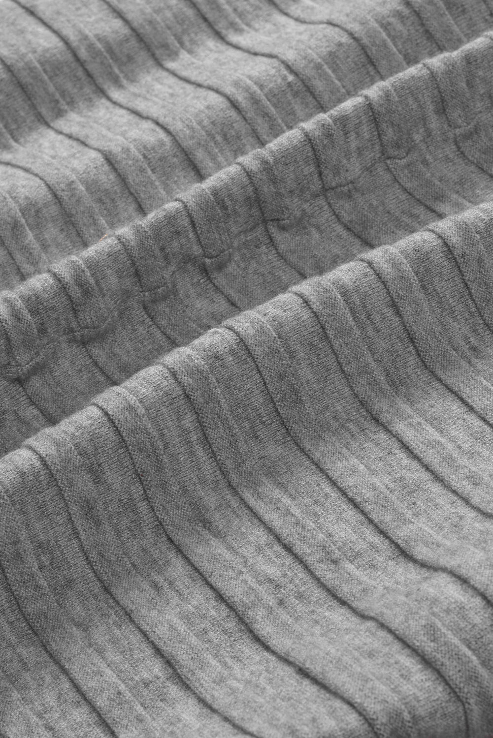 A stylish fiery red ribbed open front knit cardigan with 3/4 sleeves, perfect for layering over casual outfits.