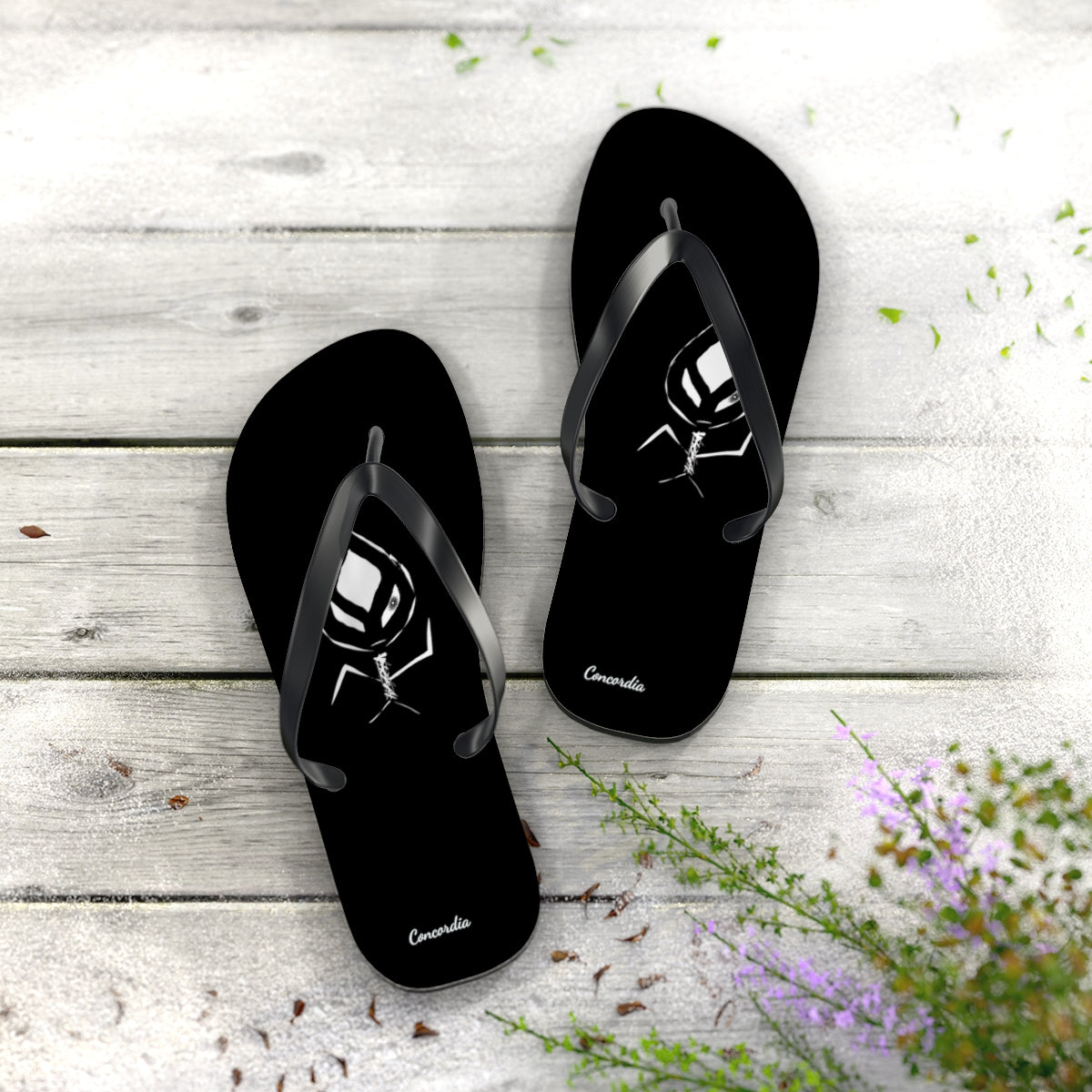 A pair of stylish flip flops with a cushioned footbed and black PVC strap, perfect for summer wear.