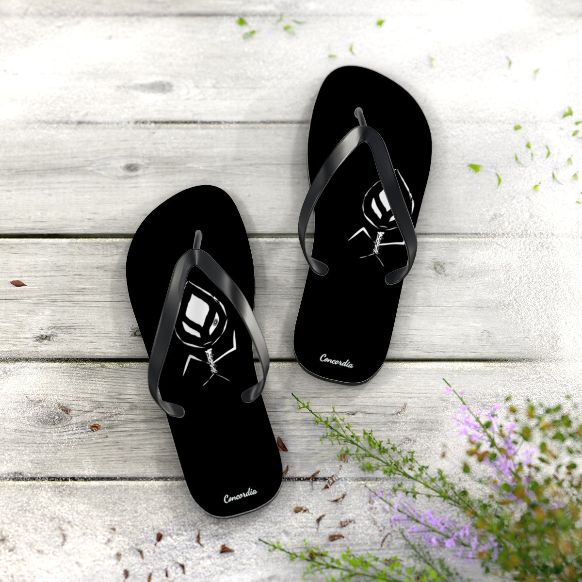 A pair of stylish flip flops with a cushioned footbed and black PVC strap, perfect for summer wear.