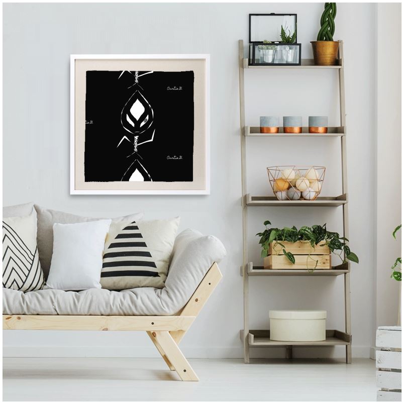 A beautifully framed silk scarf featuring intricate designs, set in a FSC certified wooden frame with a shatterproof acrylic pane.